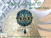 Decorative Christmas ornament with intricate design and text indicating brand and product details.