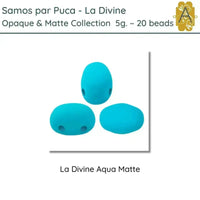 Three blue 2-hole beads labeled 'La Divine Aqua Matte' from the Opaque & Matte Collection by Samos par Puca.
