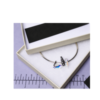 SHINE RITE 2 x 7 inch anti-tarnish strip placed inside a jewelry box to help protect jewelry from tarnish.