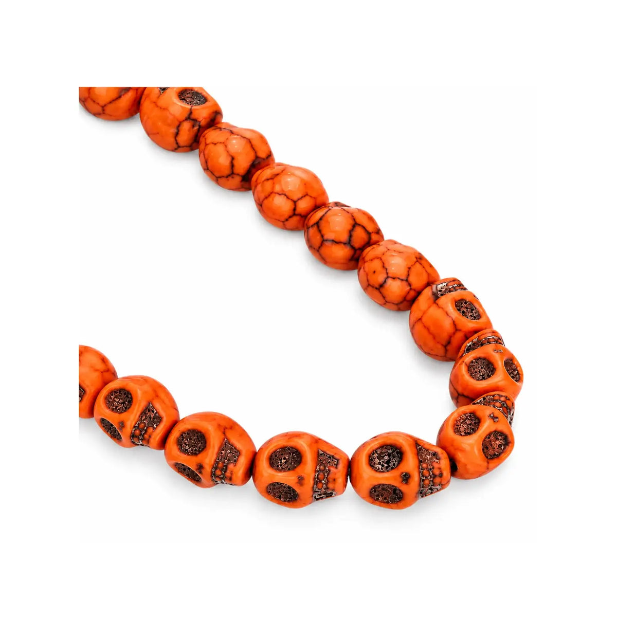 A strand of orange-red skull-shaped beads with black veining and dark eye sockets, arranged in a curved line on a plain white background.
