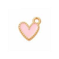 Pink enamel heart charm with gold-tone trim on a white background