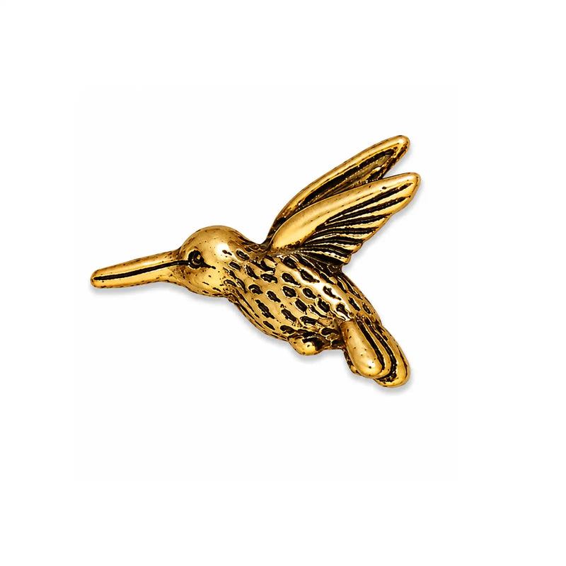 TierraCast 20mm hummingbird bead in Antique Gold on a white background.