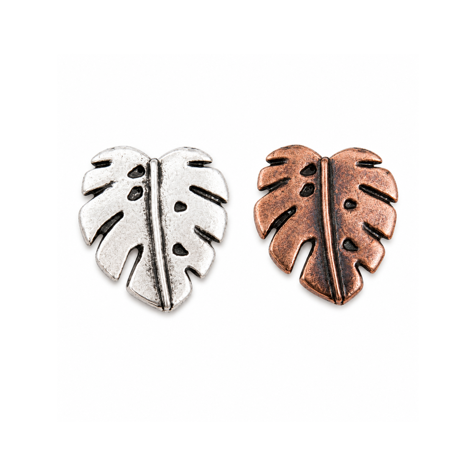 TierraCast Monstera Leaf Buttons in antique silver and antique copper finishes.