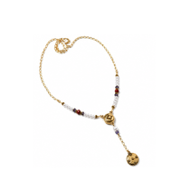 Finished beaded necklace featuring a gold TierraCast Opulence 2-to-1 Magnetic Clasp with pearl accents and a pendant drop.
