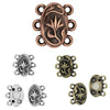 Collection of decorative metal connectors in various styles and colors on a white background