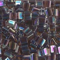 Stack of metallic rectangular 2-hole beads with a rainbow-like sheen.