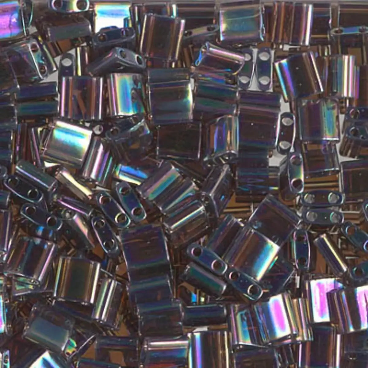 Stack of metallic rectangular 2-hole beads with a rainbow-like sheen.