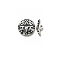An ornate round silver-toned button or clasp featuring a longhorn bull design with scrollwork and floral details, shown from both front and side views on a plain white background.