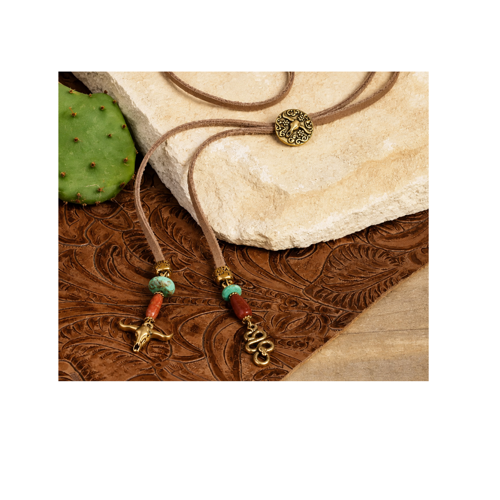 A bohemian-style necklace with a brown cord, bronze-toned circular medallion, turquoise beads, red spacer beads, and dangling animal-shaped charms, styled on a carved brown wood surface with a cactus and stone prop.