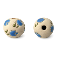 Two ceramic beads with blue and green patterns on a white background