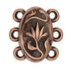 Decorative copper clasp with intricate design on a white background