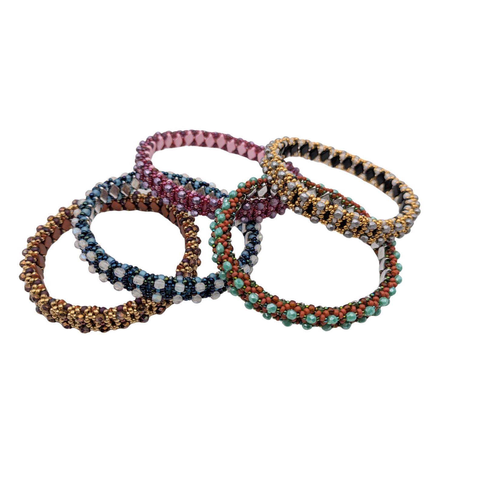 Set of colorful beaded bracelets on a white background