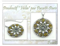 Jewelry pendant with green and silver design on a white card, featuring the brand 'Puca'.