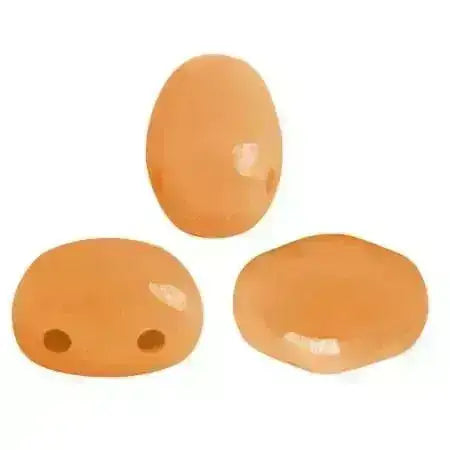 Three orange 2-hole beads on a white background