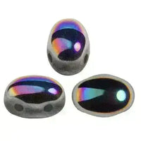 Three metallic 2-hole beads with rainbow reflections on a white background