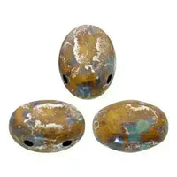 Three oval 2-hole beads with a metallic gold and blue pattern on a white background