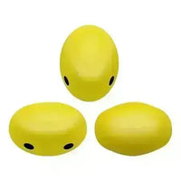 Three yellow oval-shaped 2-hole beads on a white background