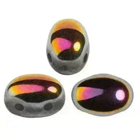 Three colorful glass 2-hole beads with a rainbow pattern on a white background